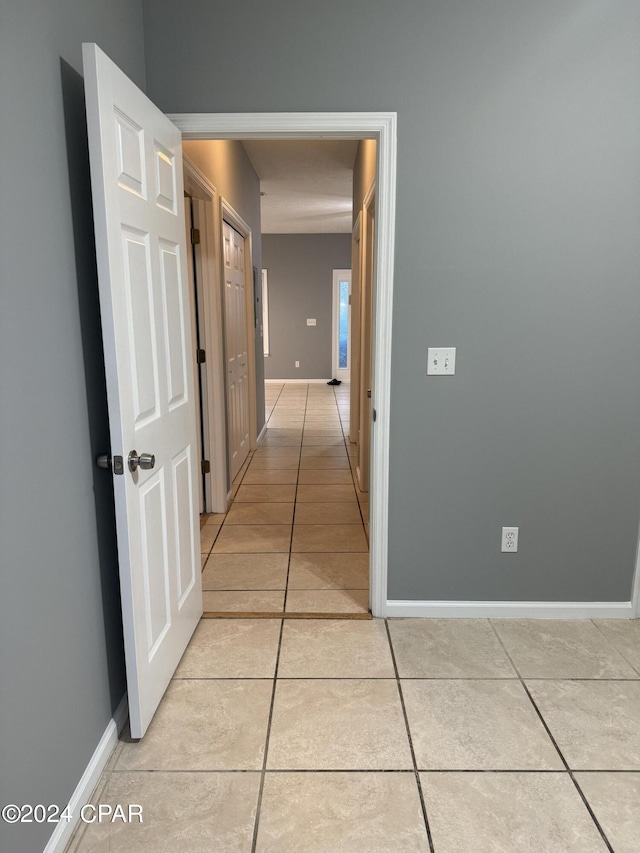 hallway with light tile patterned flooring