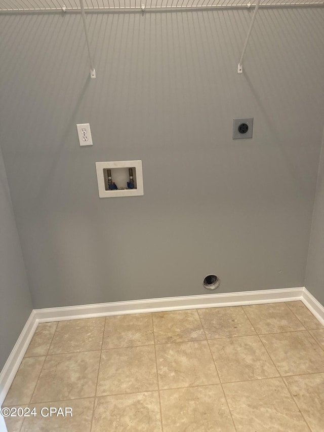 laundry room featuring washer hookup, hookup for an electric dryer, and light tile patterned flooring