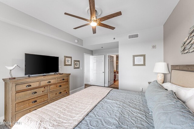 bedroom featuring ceiling fan and connected bathroom