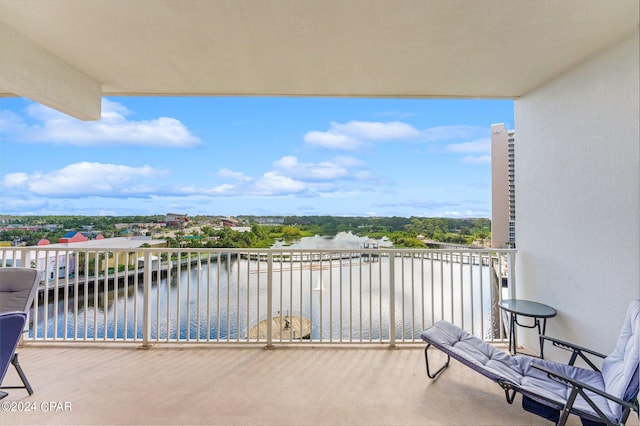 balcony featuring a water view