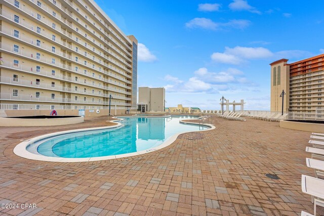 view of swimming pool with a patio area