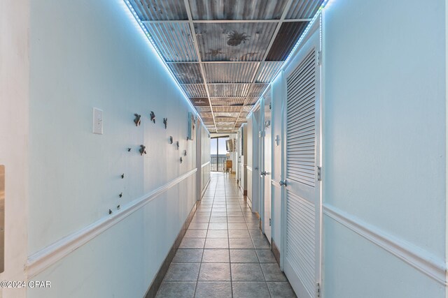 corridor with tile patterned flooring