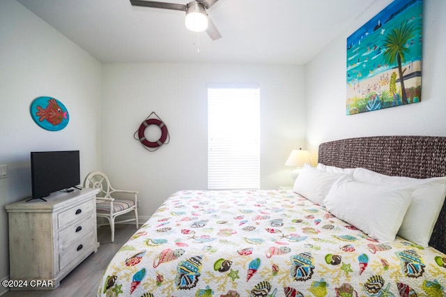 bedroom with light wood-type flooring and ceiling fan