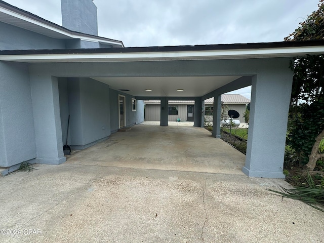 garage featuring a carport