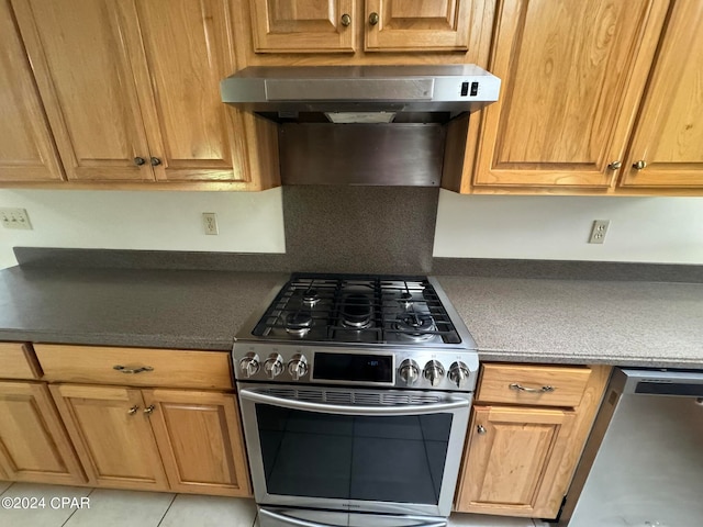 kitchen with appliances with stainless steel finishes and wall chimney exhaust hood