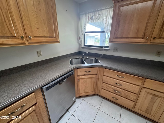 kitchen with light tile patterned floors, dishwasher, and sink