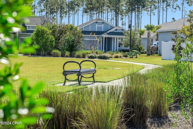 view of property's community featuring a yard