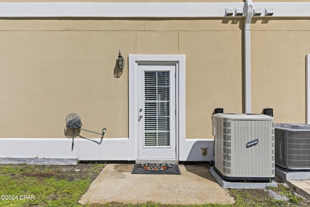 property entrance with central AC unit