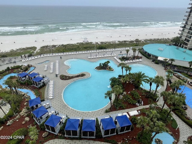 aerial view with a water view and a view of the beach
