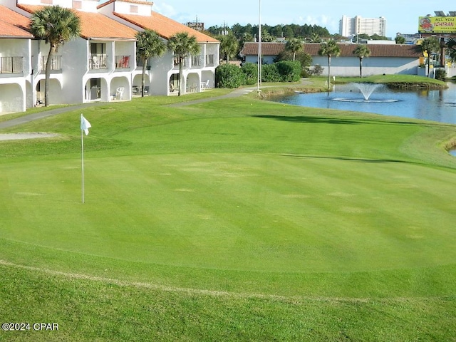 surrounding community featuring a water view and view of golf course