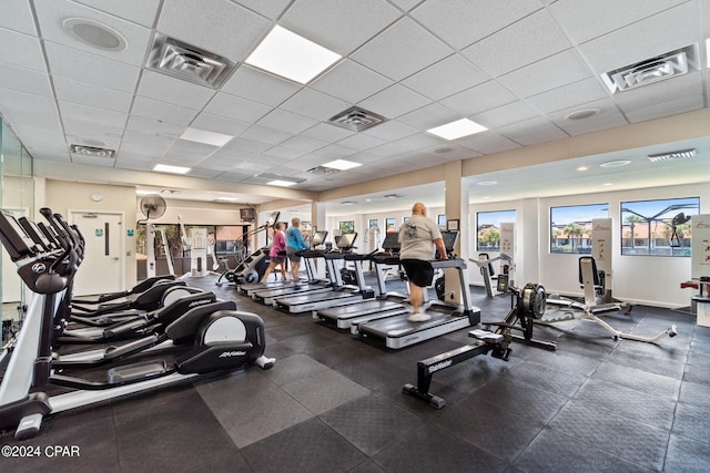 exercise room featuring visible vents and a paneled ceiling