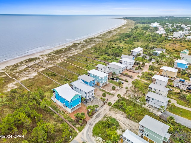 aerial view featuring a water view and a beach view