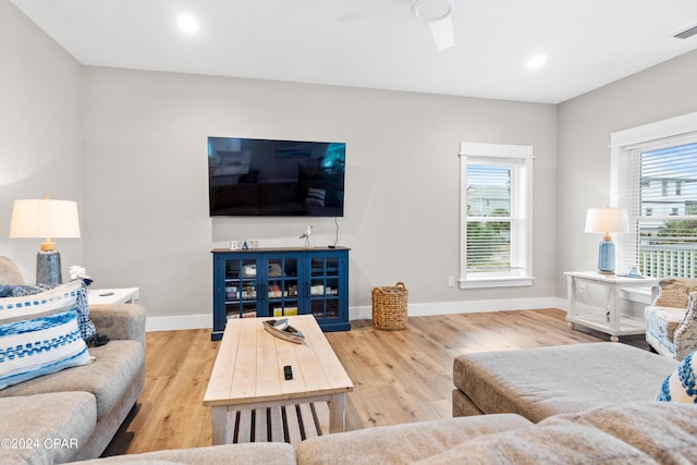 living room with ceiling fan and hardwood / wood-style floors