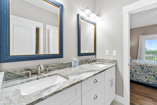 bathroom featuring vanity and hardwood / wood-style floors