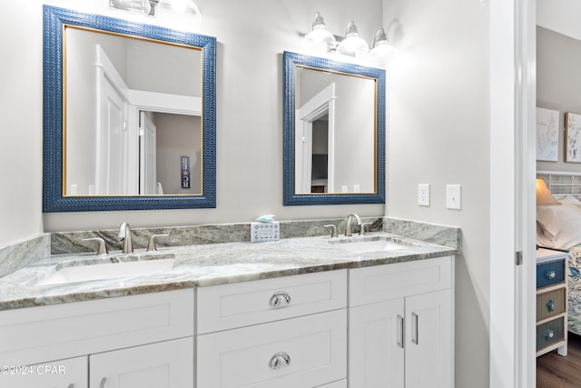 bathroom featuring vanity and hardwood / wood-style flooring