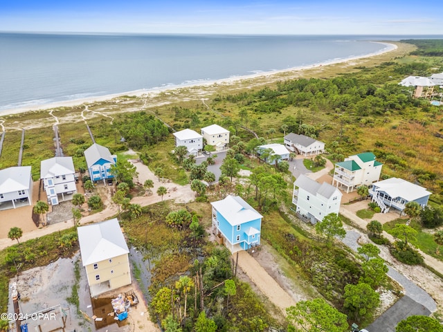 aerial view featuring a view of the beach and a water view