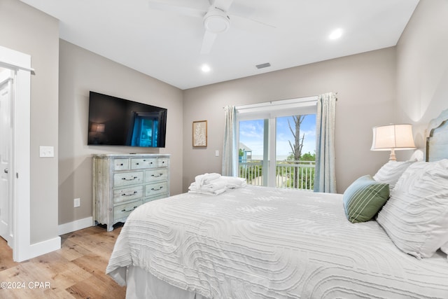 bedroom featuring light hardwood / wood-style flooring, ceiling fan, and access to exterior