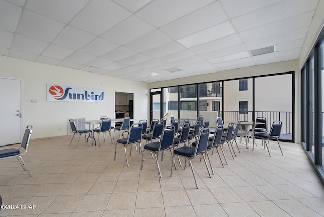 interior space featuring a drop ceiling