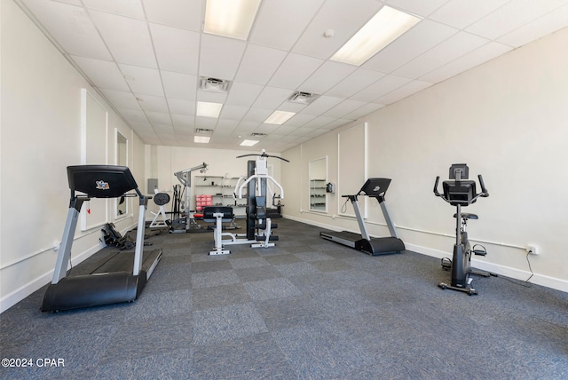 interior space with a paneled ceiling