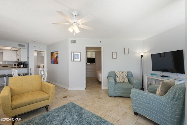 living room featuring ceiling fan