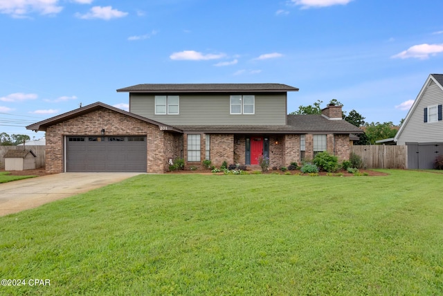 view of front property with a front yard and a garage