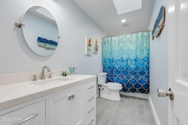 bathroom featuring hardwood / wood-style floors, vanity, toilet, and a shower with curtain