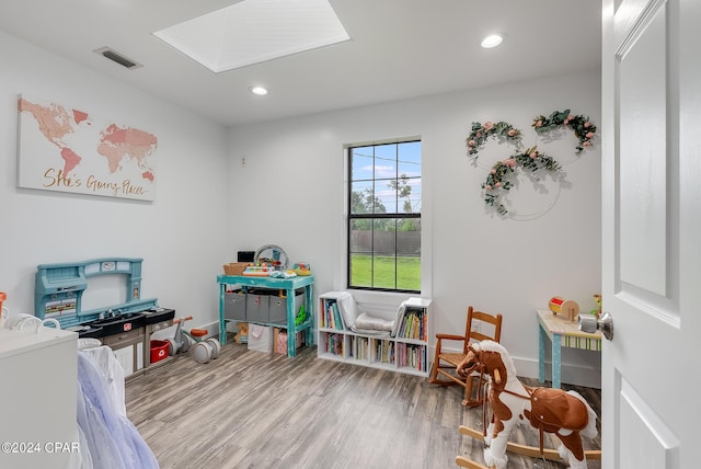 game room featuring light wood-type flooring