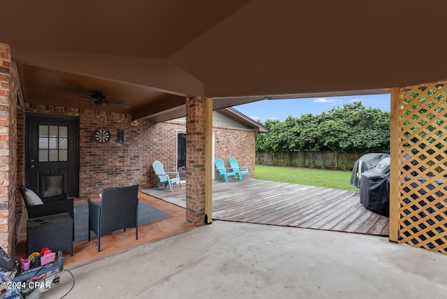 view of patio with ceiling fan and a deck