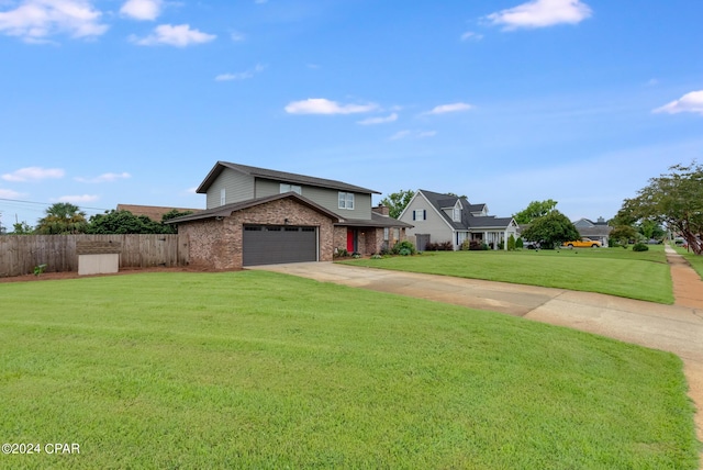 view of property with a front lawn and a garage