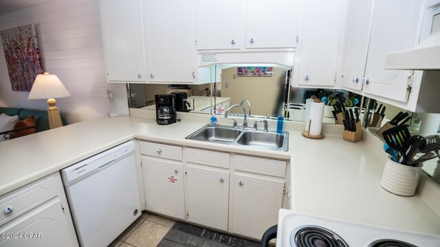 kitchen with white cabinetry, light tile patterned floors, white dishwasher, exhaust hood, and sink