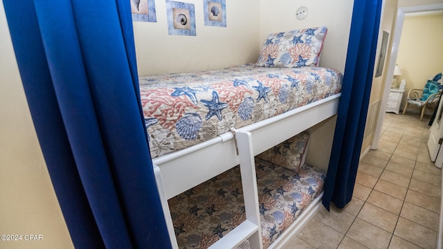 bedroom featuring light tile patterned floors