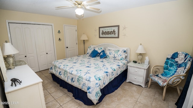 tiled bedroom with ceiling fan