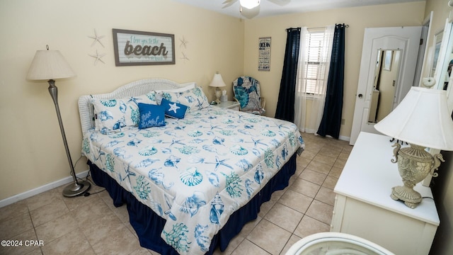 bedroom with baseboards and light tile patterned flooring
