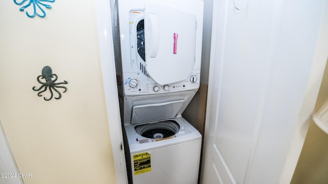 washroom featuring stacked washer / dryer