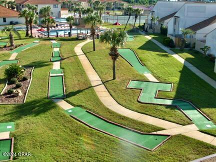 view of home's community featuring a lawn