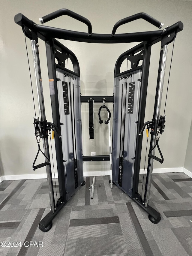 exercise room with baseboards