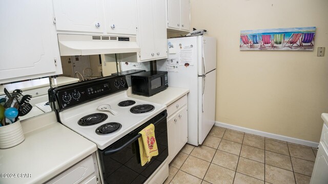 kitchen with white cabinets, electric stove, light tile patterned floors, and extractor fan