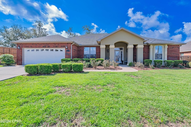 ranch-style home with brick siding, a front lawn, fence, concrete driveway, and an attached garage