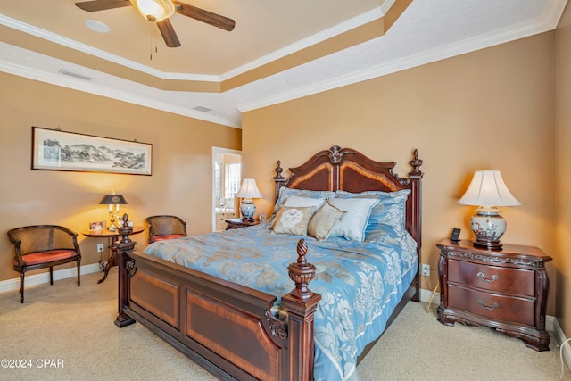 bedroom featuring visible vents, crown molding, a raised ceiling, and baseboards