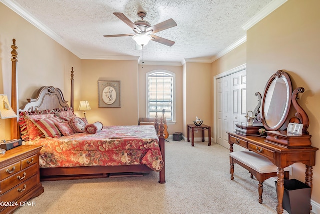 bedroom with ceiling fan, light colored carpet, a closet, and ornamental molding