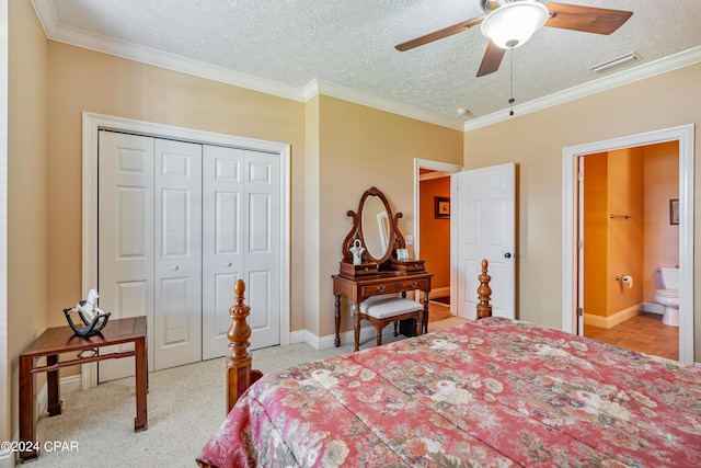 bedroom featuring visible vents, carpet floors, a closet, a textured ceiling, and crown molding