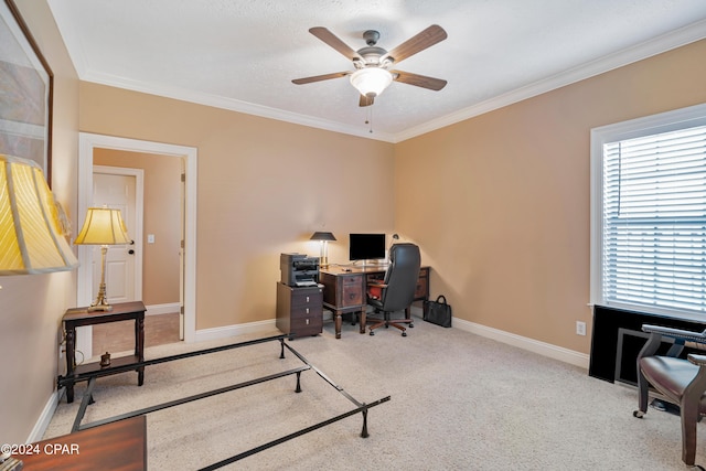 office space with a ceiling fan, baseboards, carpet floors, and ornamental molding