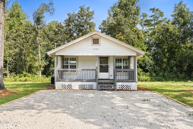 view of front of property featuring a porch and central AC