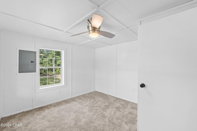 carpeted empty room featuring ceiling fan and electric panel