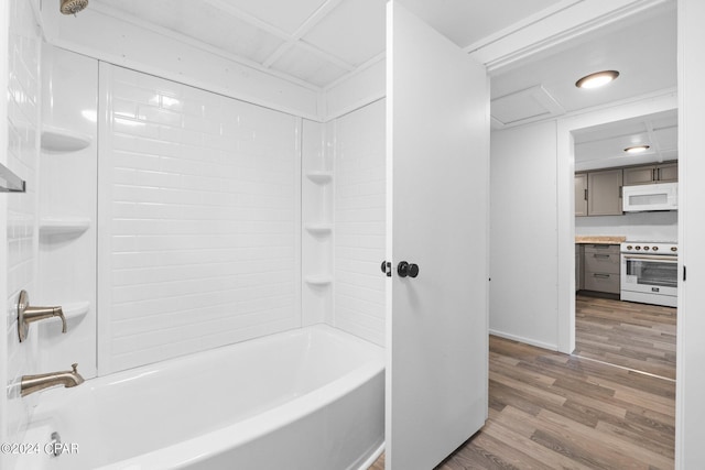 bathroom featuring shower / washtub combination and hardwood / wood-style flooring