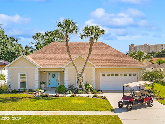 view of front facade with a garage and a front lawn