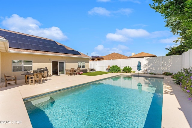 view of swimming pool with a patio area