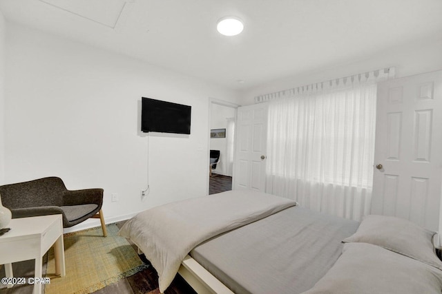 bedroom with wood-type flooring