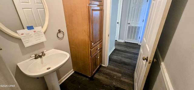 bathroom with sink and hardwood / wood-style flooring