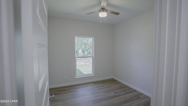 empty room featuring ceiling fan and hardwood / wood-style flooring